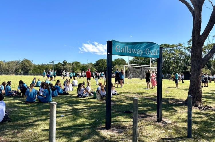 A group of students in participating in sporting activities on our school oval