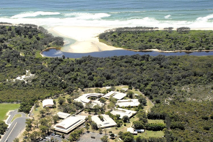 Arial view of Byron Bay High school including Arakwal National Park and Tallow Beach